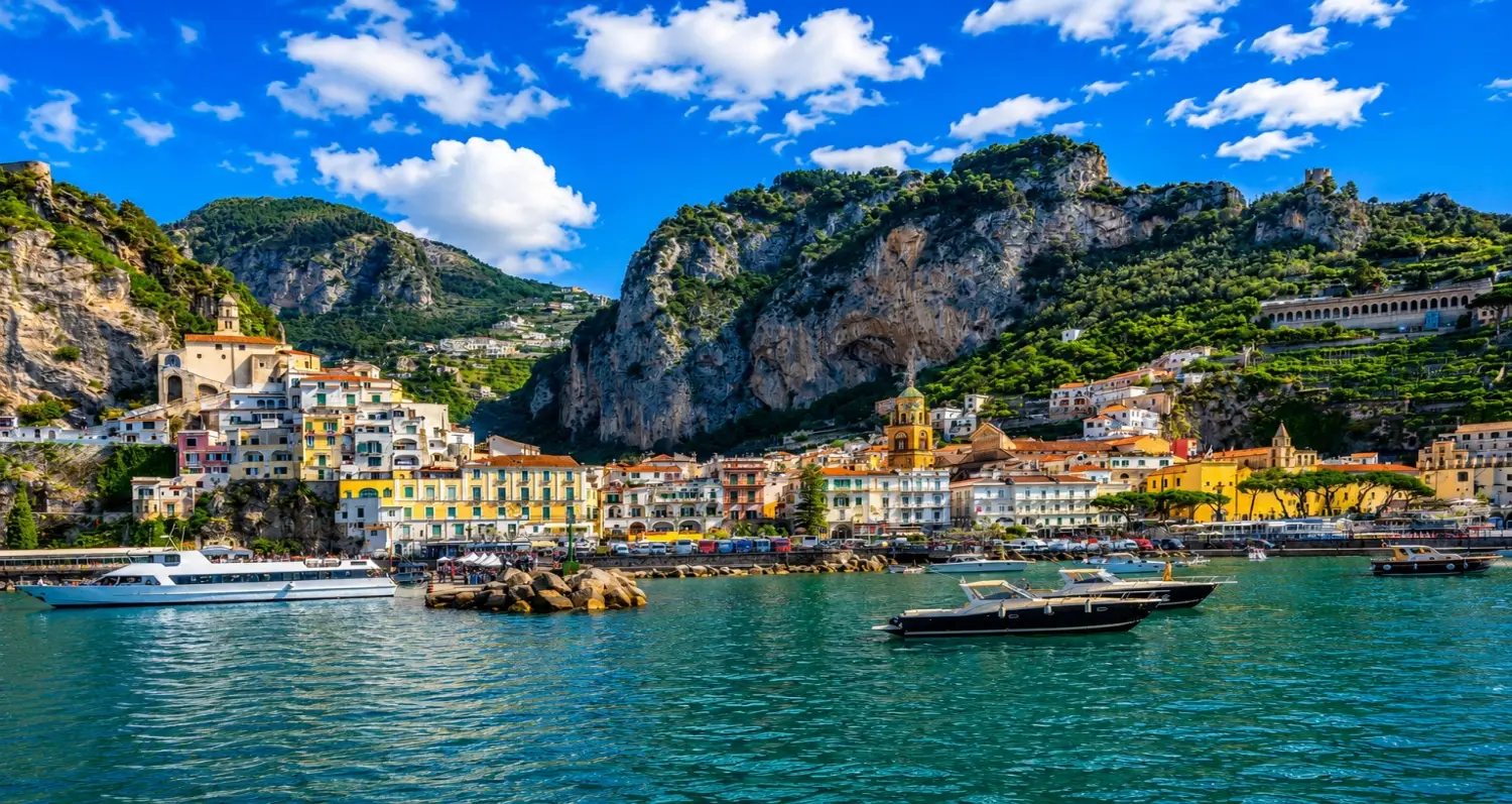 The historic seaside town of Amalfi, set against dramatic cliffs along the famous Amalfi Coast in Italy.
