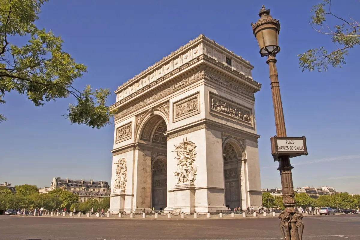 The Arc de Triomphe in Paris, a triumphal arch situated at the center of the Place Charles de Gaulle at the western end of the famous Champs Elysees avenue.