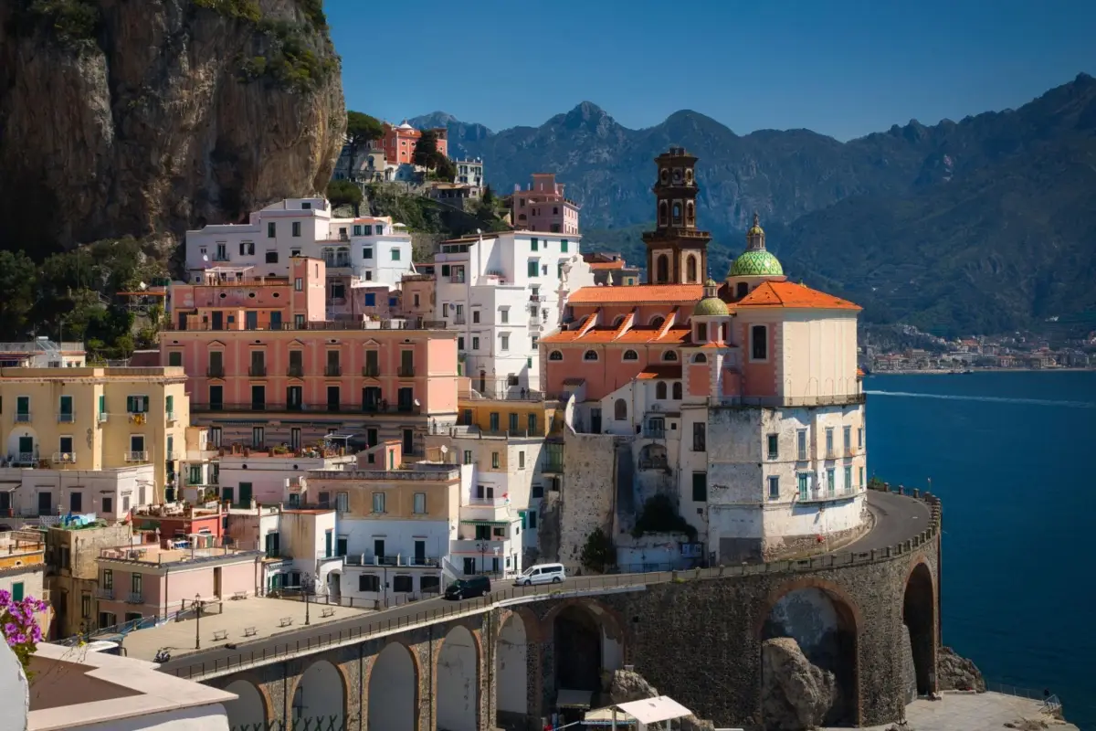 The tiny town of Atrani, known for its narrow alleyways, archways and compact beach is located on the Amalfi Coast in Italy.