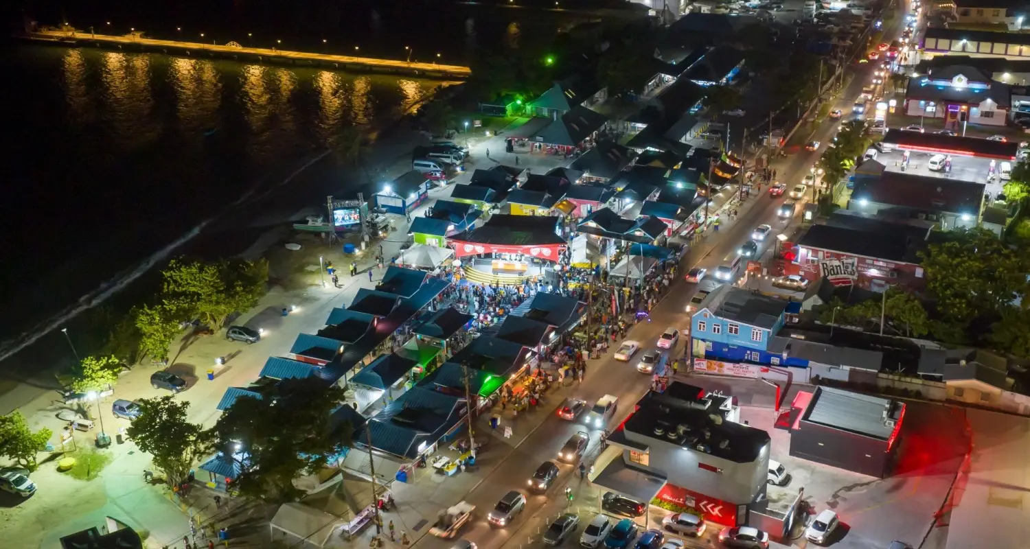 Aerial view of crowded food stalls at Oistins Fish Fry in Christ Church, Barbados on a busy Friday night.
