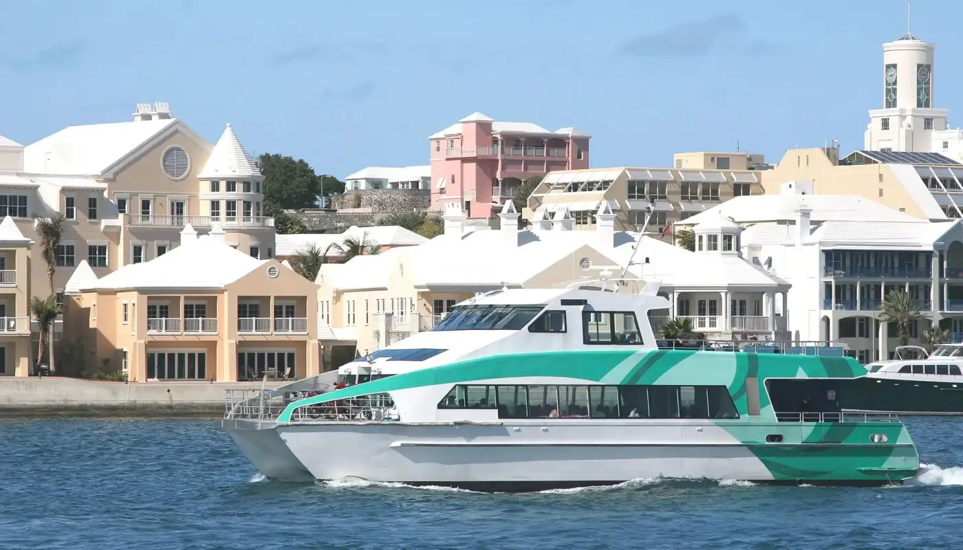 A high-speed catamaran ferry, used for public transport, leaving the Hamilton Ferry Terminal in Bermuda.