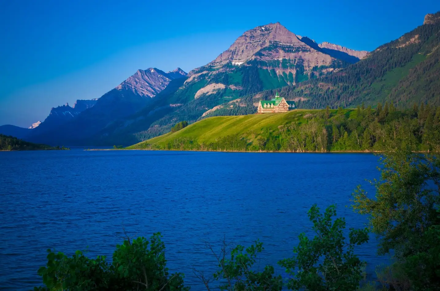 Prince of Wales Hotel, situated on a bluff overlooking Upper Waterton Lake in Waterton Lakes National Park, Alberta, Canada.