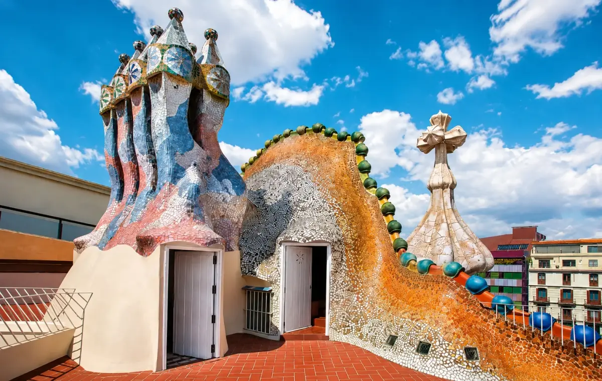 Casa Batllo appears less like an ordinary building and more like a living work of art, with its shimmering facade, flowing balconies, colorful mosaics and sculptural rooftop.