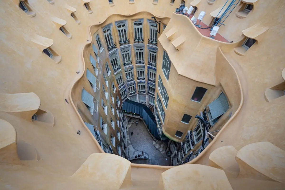 On Barcelona’s elegant Passeig de Gracia, Casa Mila rises like a wave of pale stone against the city’s orderly streets.