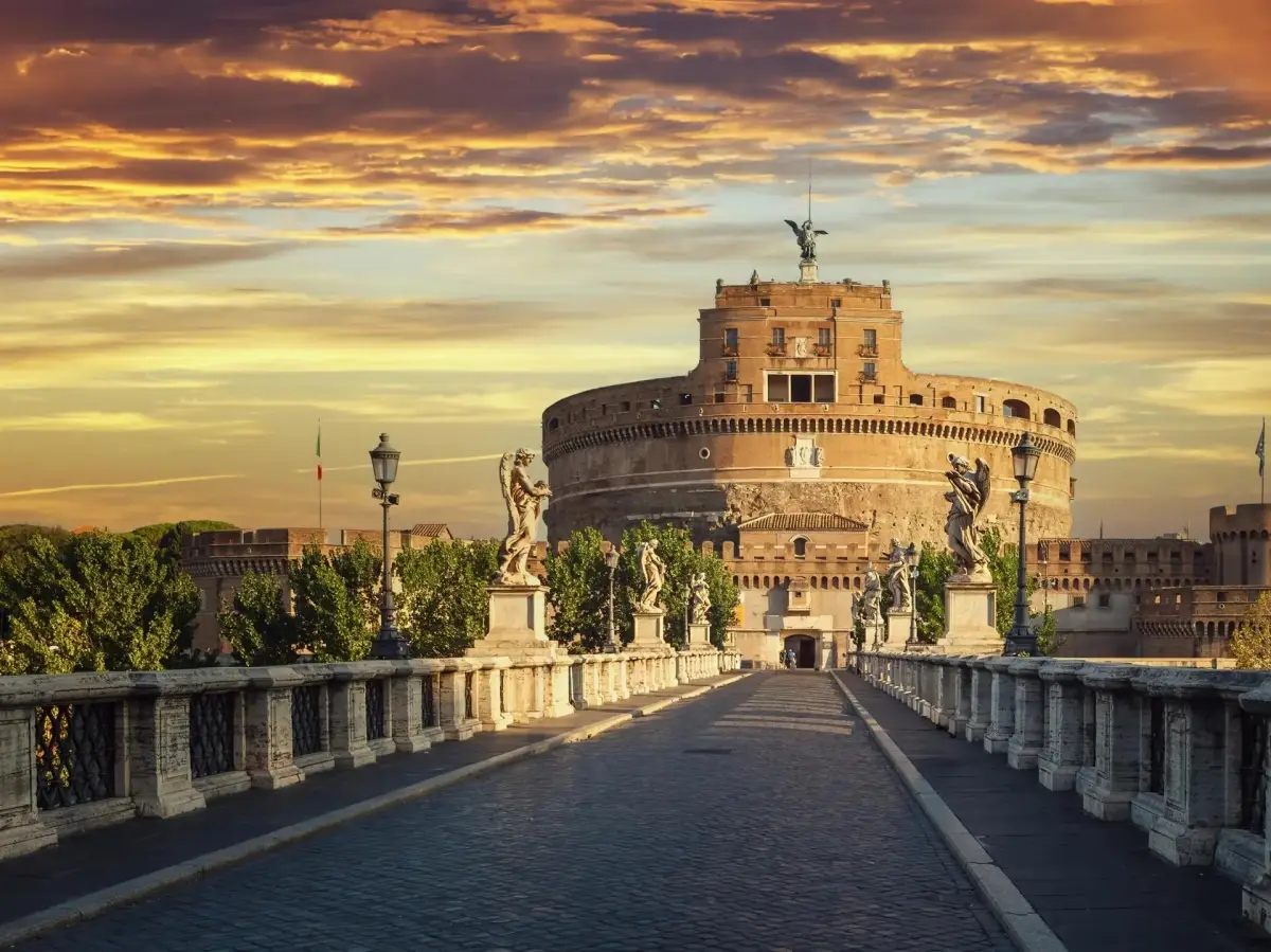 Castel Sant'Angelo is a historic monument and fortress located along the banks of the Tiber River in Rome, Italy and is lined with statues on the Ponte Sant'Angelo bridge.