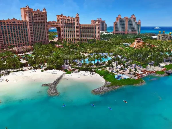 Aerial view of tourists kayaking in the crystal-clear turquoise waters of Atlantis Paradise Island in the Bahamas.