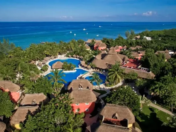 Aerial view of Iberostar Waves Cozumel resort bungalows and outdoor pools along the Caribbean beach in Mexico.