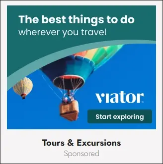 Ad: Viator travel advertisement showing hot air balloons floating in a blue sky with the text 'The best things to do wherever you travel'.