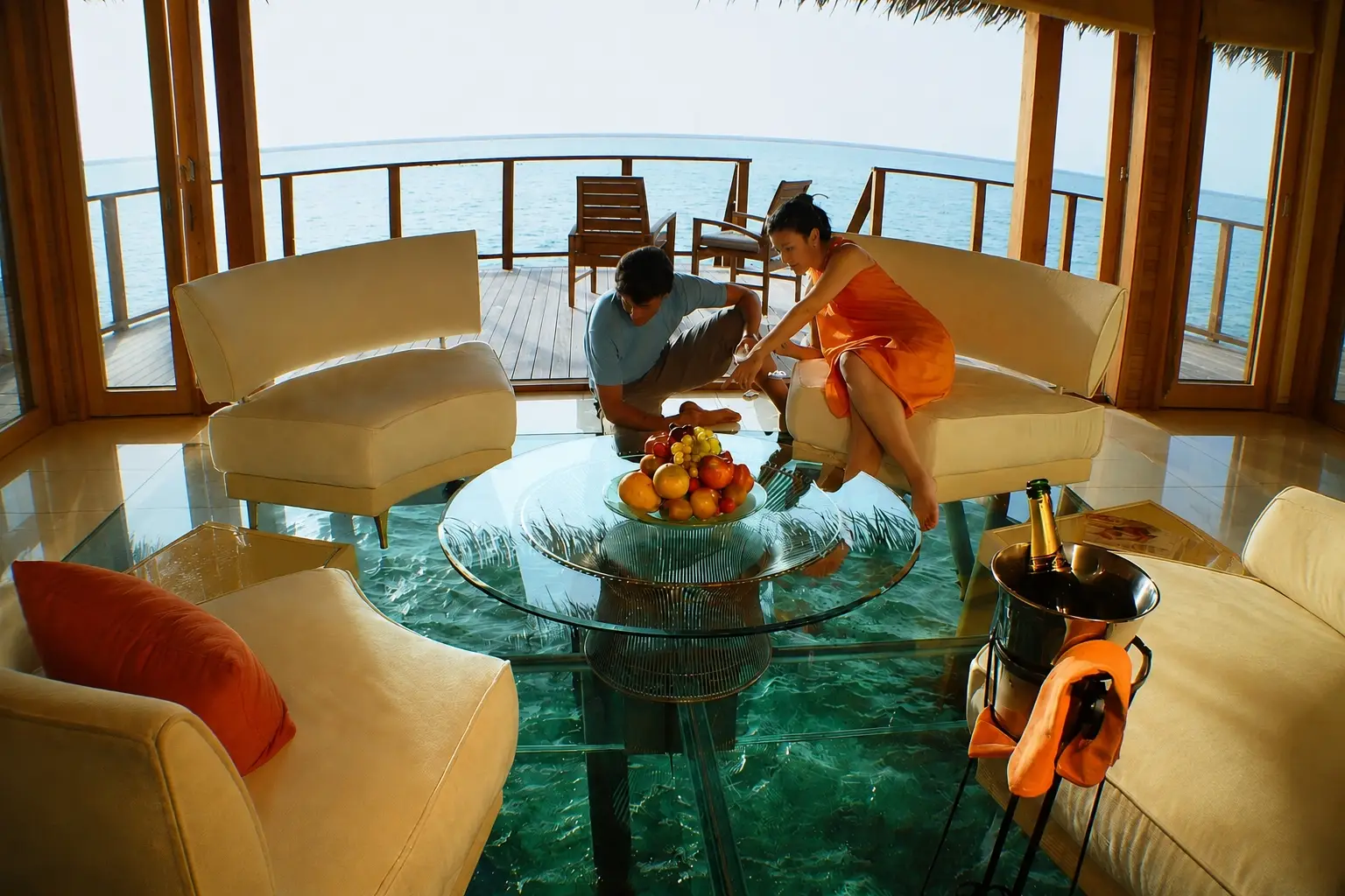 A luxury water villa in the Maldives with a unique glass floor design. (@beautifuldestinations)