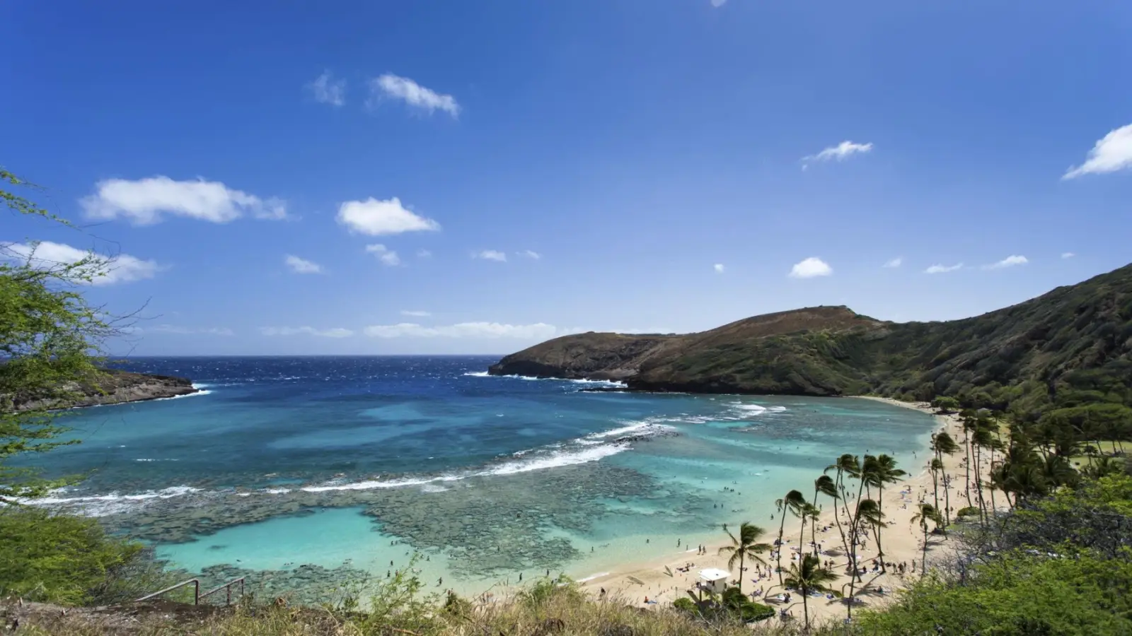 The Hanauma Bay Nature Preserve located on Oahu, Hawaii, a marine life conservation area formed within a collapsed volcanic crater.