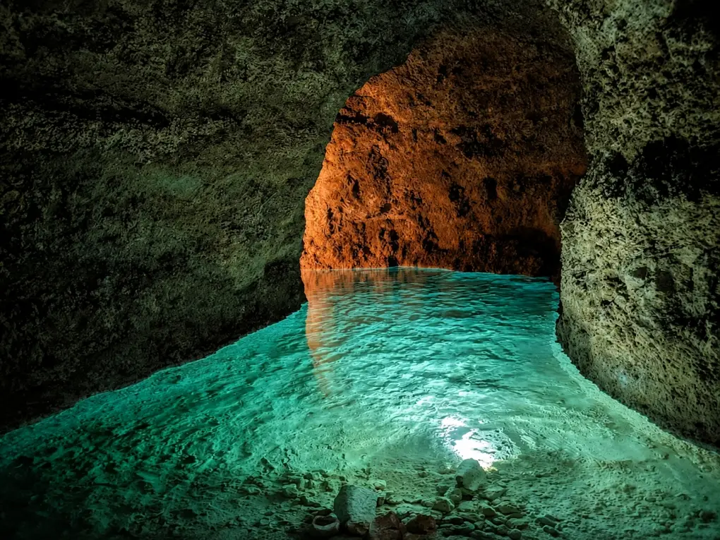 Harrison's Cave in Barbados is a limestone cavern known for its crystal-clear streams and stalactites.