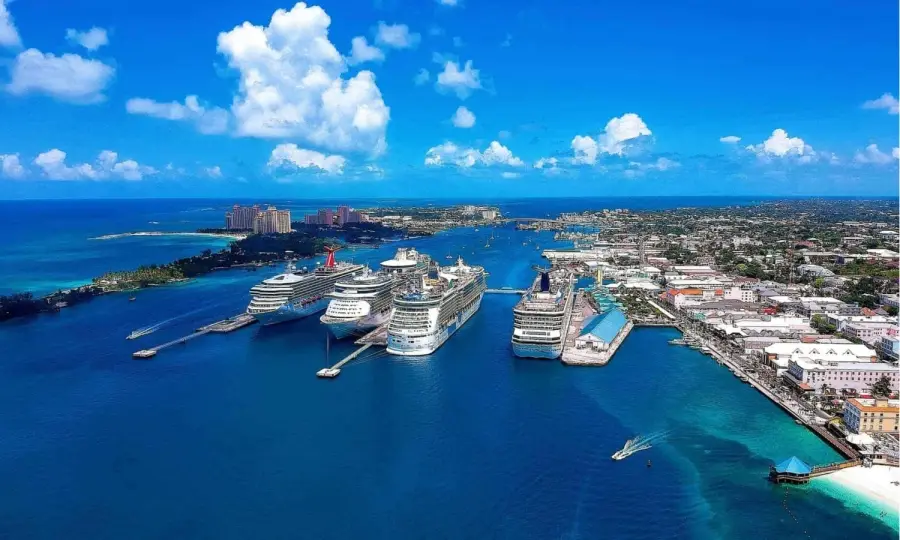 Multiple cruise ships docked at the Nassau Cruise Port in the Bahamas, which includes a recently revitalized port facility and is located near downtown Nassau.