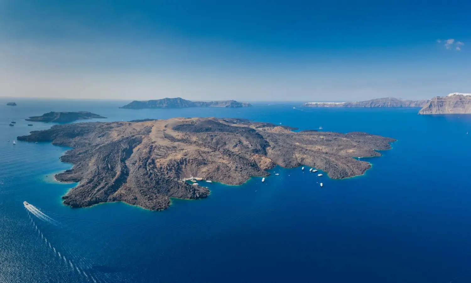 Aerial view of Nea Kameni volcano island inside the Santorini caldera, Greece.