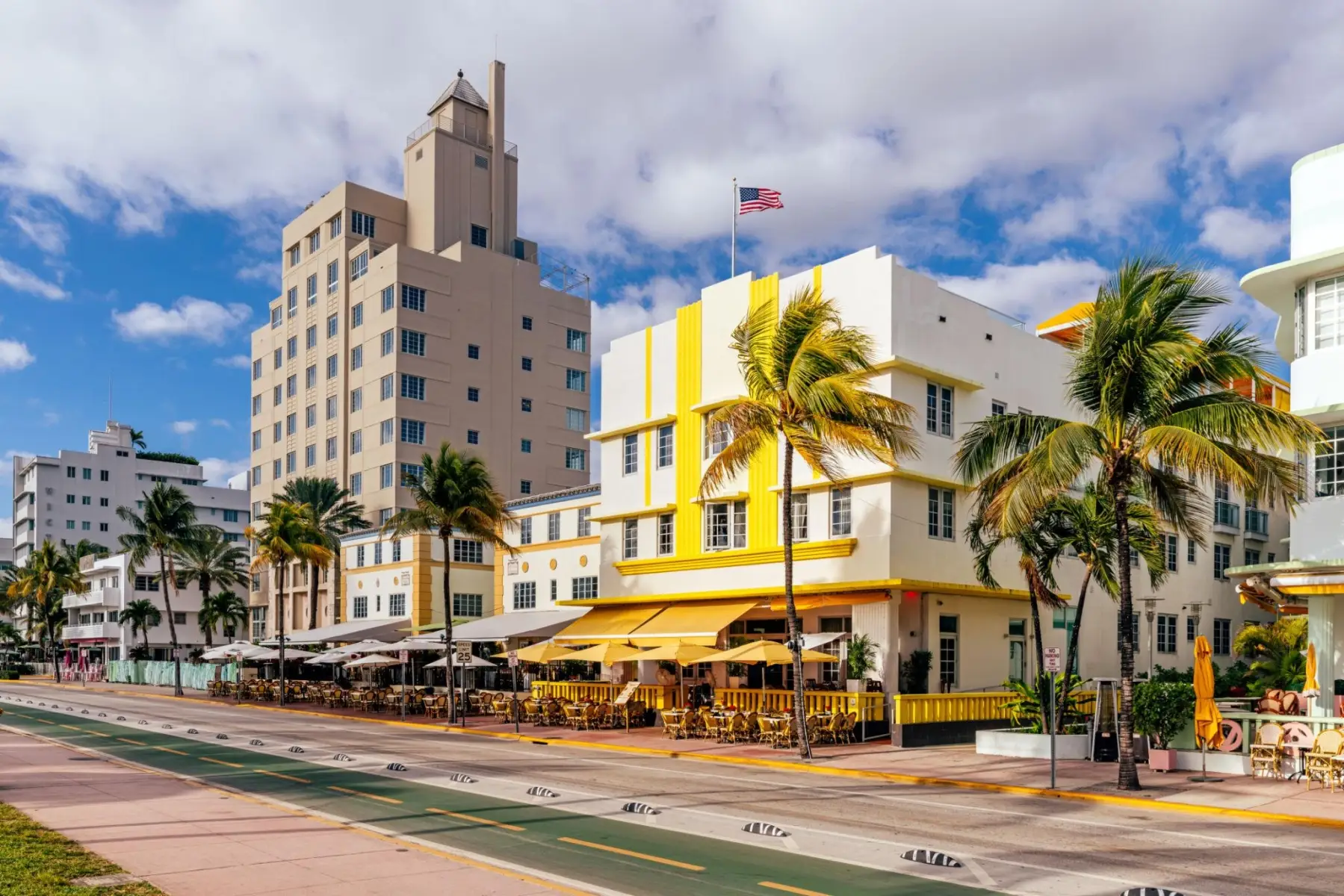 Yellow Art Deco Leslie Hotel on Ocean Drive in South Beach Miami, directly across from Lummus Park and the beach.
