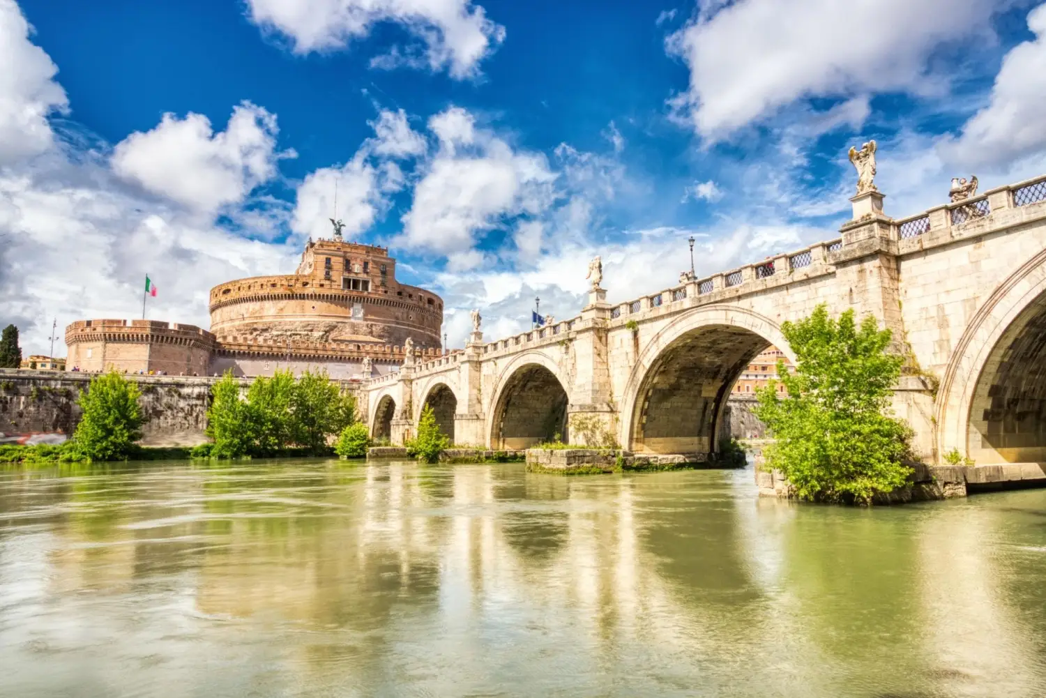 Castel Sant Angelo and Ponte Sant Angelo bridge over the Tiber River in Rome Italy.