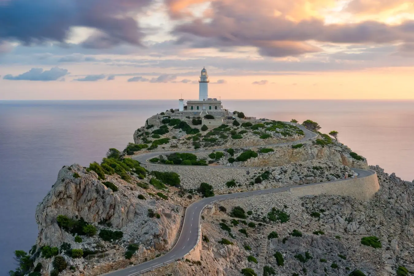 The Formentor Lighthouse located on the northernmost tip of Mallorca, Spain is perched on a spectacular cliff 200 meters above sea level at Cap de Formentor.