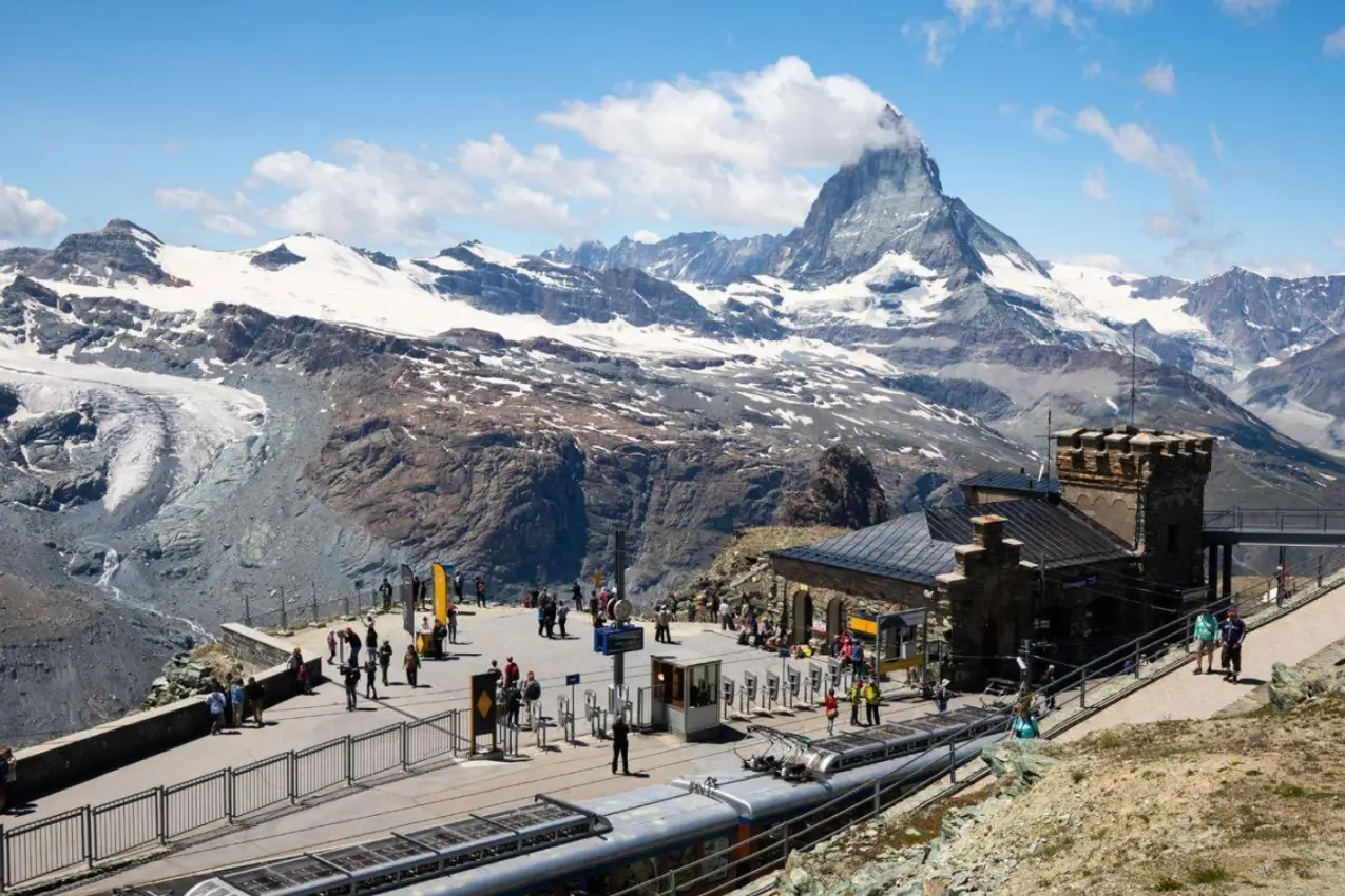Gornergrat Bahn train station and scenic viewing platform overlooking the Matterhorn mountain.