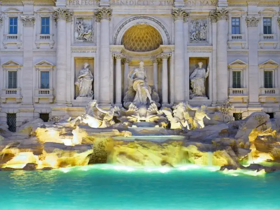 Tucked into a lively square surrounded by elegant streets and historic buildings, the Trevi Fountain looks like a scene from a classic Italian film.