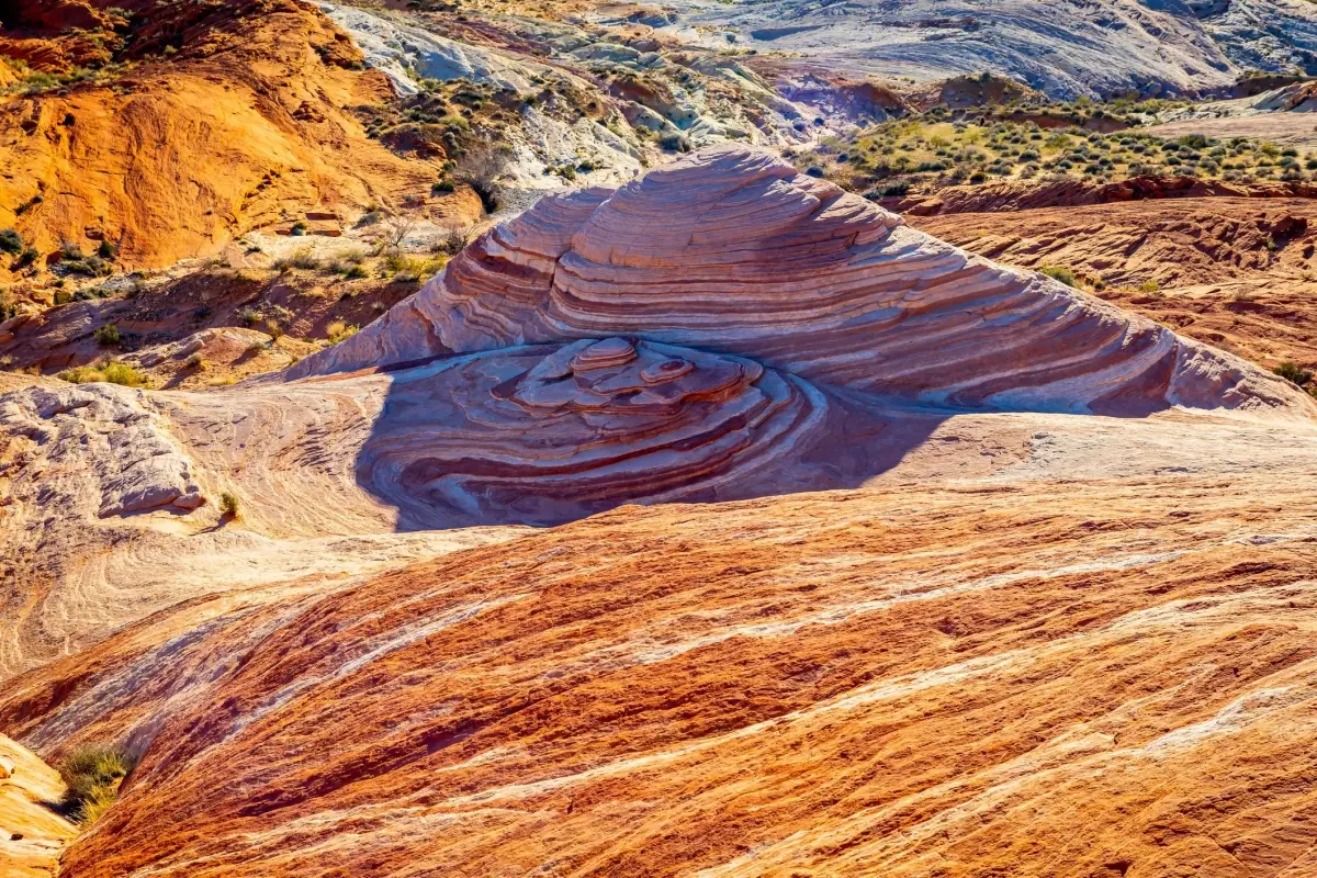 Valley of Fire State Park is Nevada's oldest and largest state park, world-renowned for its 46,000 acres of vibrant, fiery-red Aztec sandstone formations that appear to glow under the desert sun.